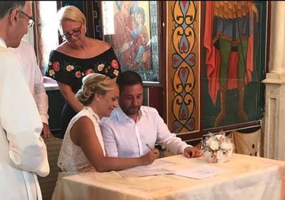 Signing the legal certificates after the religious portion of a wedding by the Anglican Church of Paphos