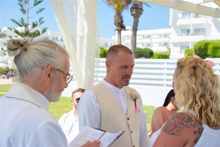 Bright, happy, sun and special times at a hotel beach wedding by the Anglican Church of Paphos