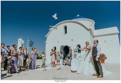 Releasing doves into blue sky after marrying in Paphos with the Anglican Church of Paphos